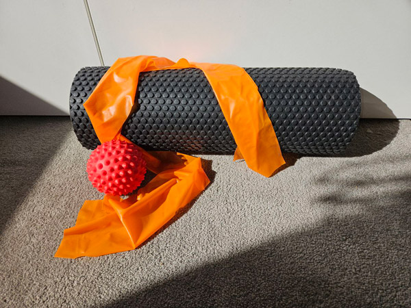 Foam roller, spikey ball and theraband to manage pain at home