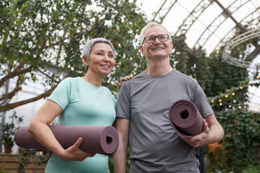 two older people ready to exercise